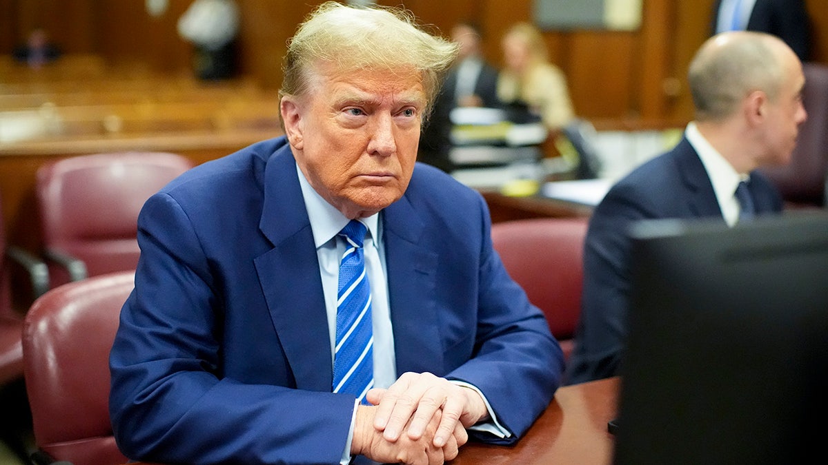 Former President Donald Trump awaits nan commencement of proceedings connected nan 2nd time of assemblage action astatine Manhattan criminal court