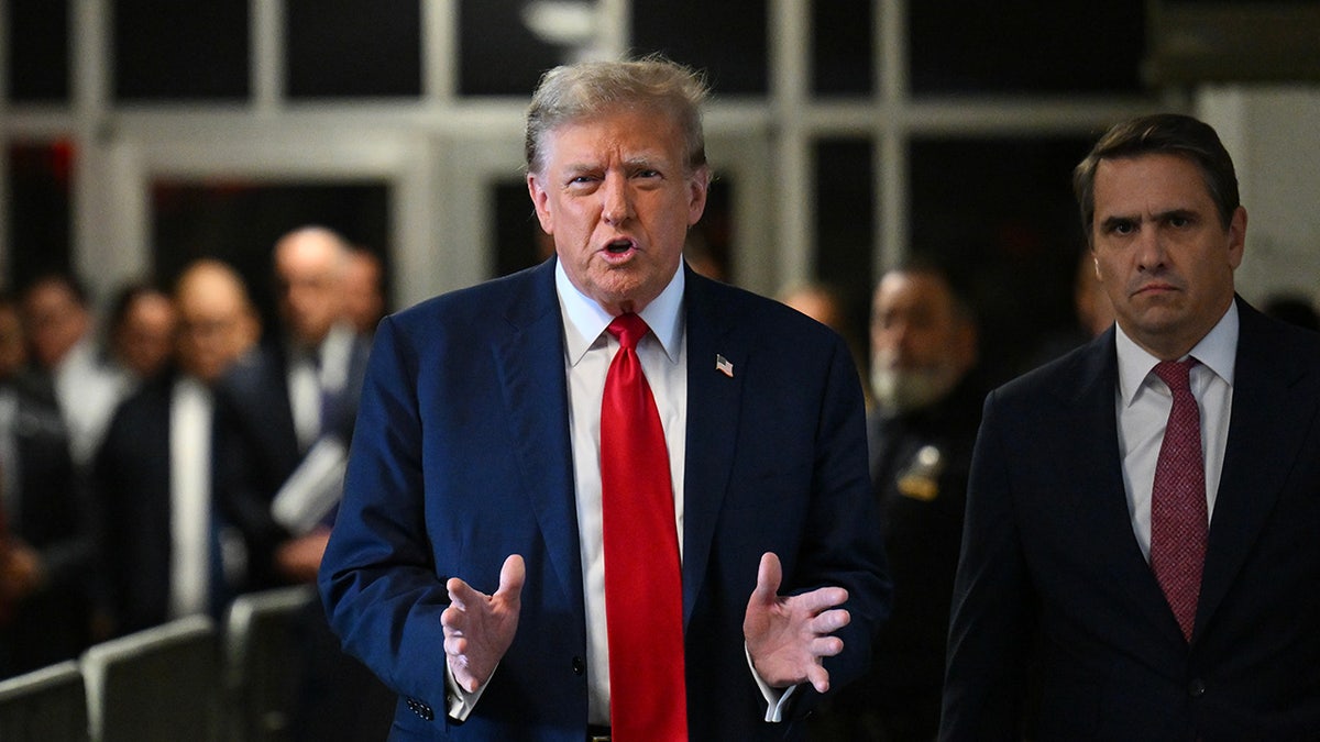 former President Trump successful  reddish  tie, acheronian  overgarment  speaking to press