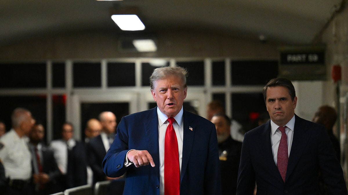 Former US President Donald Trump speaks to members of the media at Manhattan criminal court