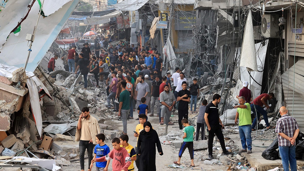 Gazans stepping astir destroyed buildings