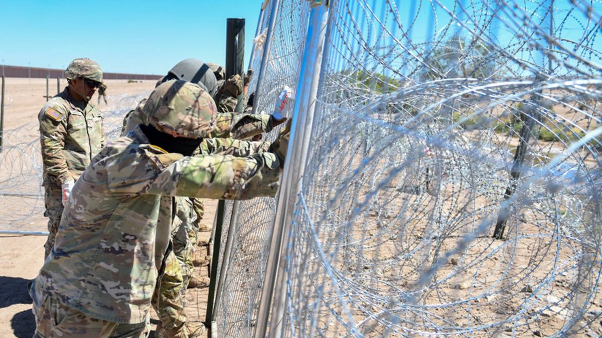 Texas National Guard installing razor wire