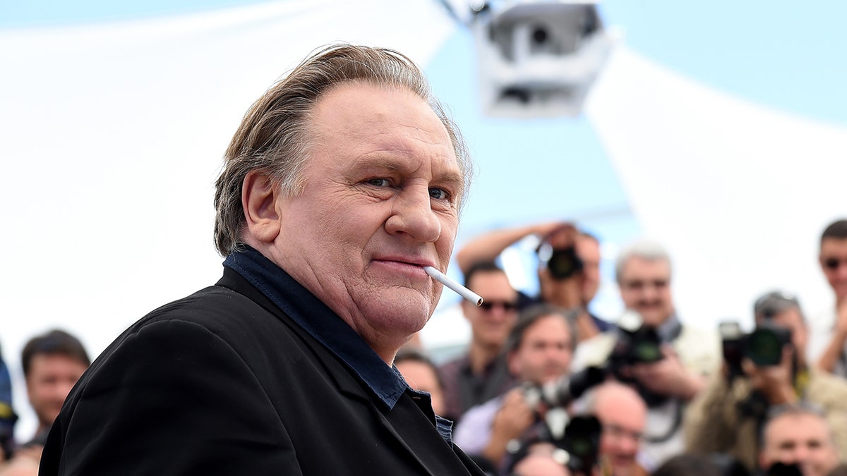 Gerard Depardieu wears achromatic connected nan reddish carpet