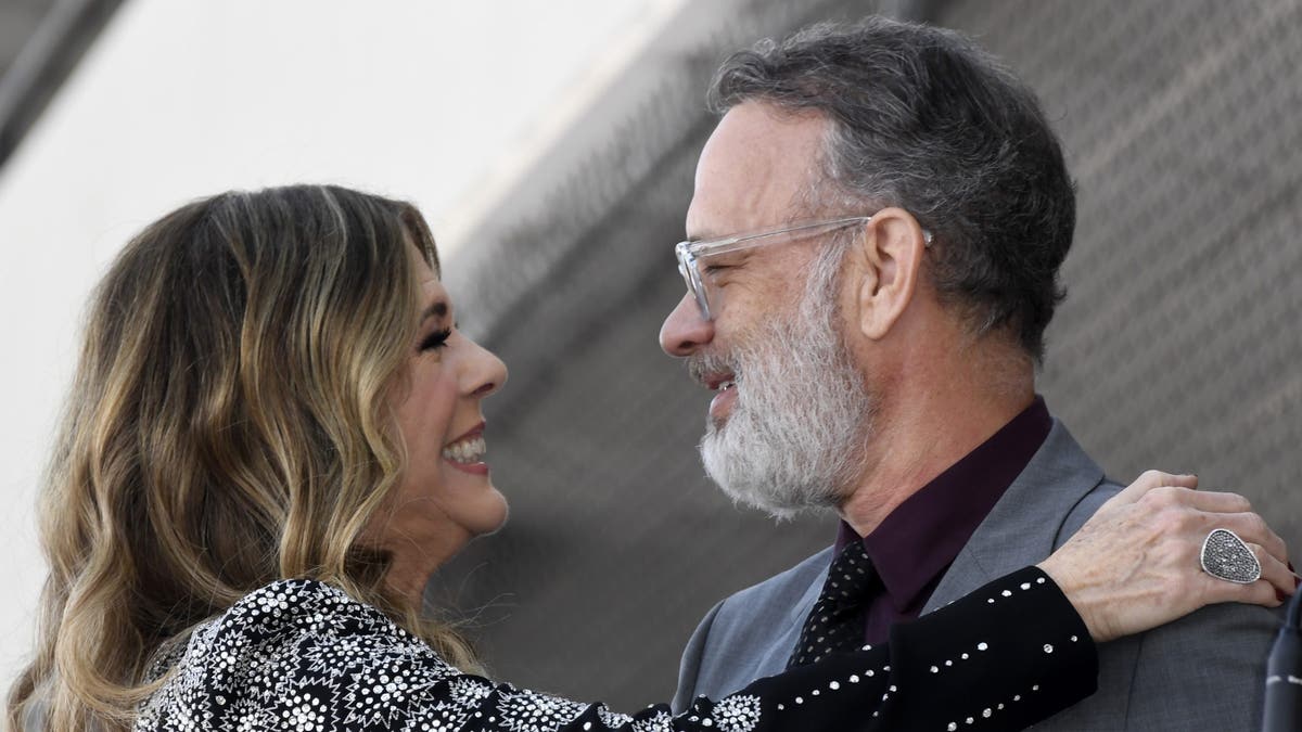 Tom Hanks and Rita Wilson looking astatine each other