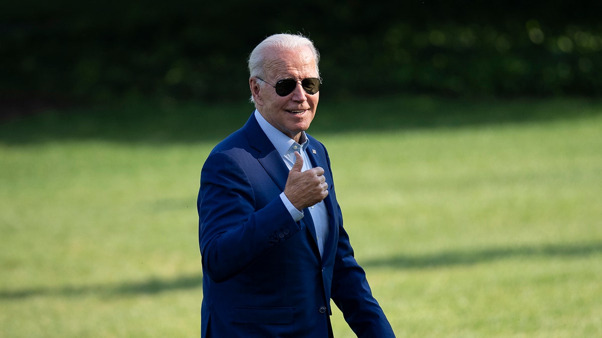 Biden walking, smiling