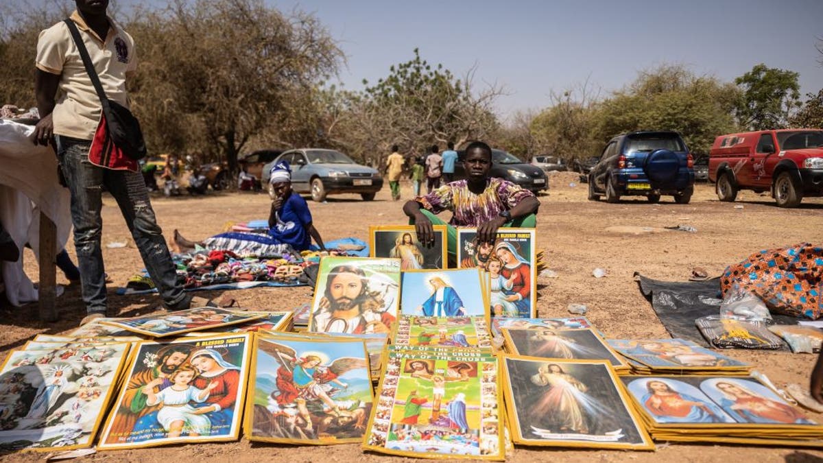 Boy selling memorabilia 