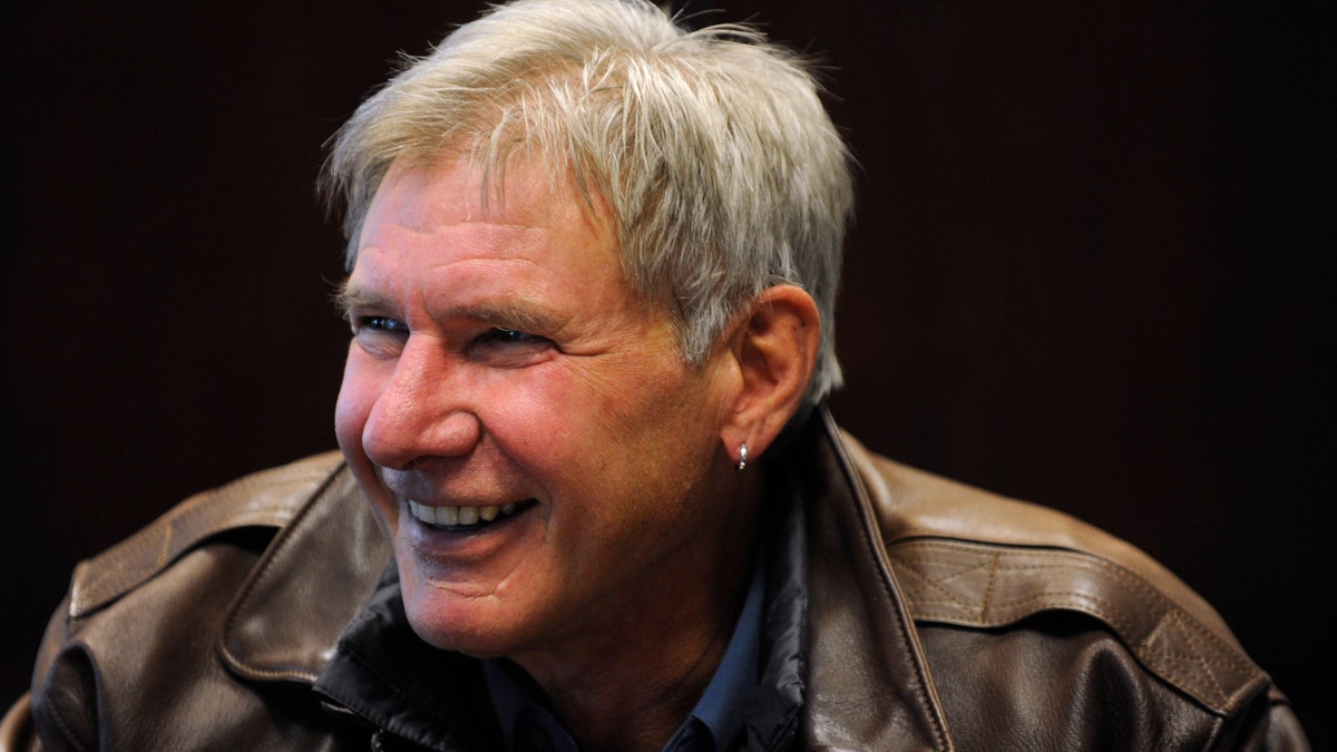 harrison ford smiling with earring