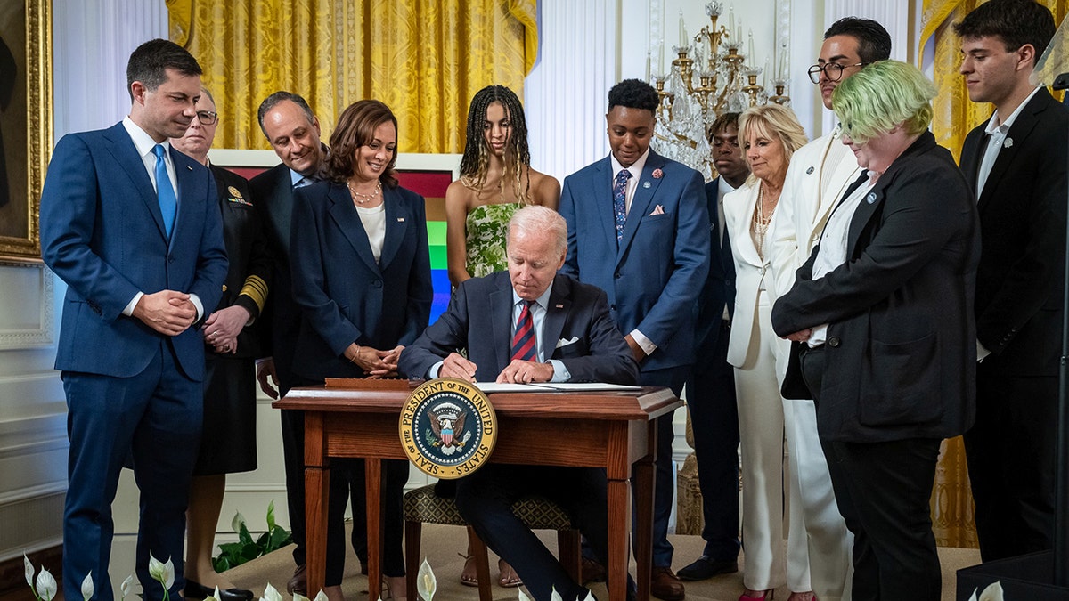 Melania Trump Biden signing an executive order