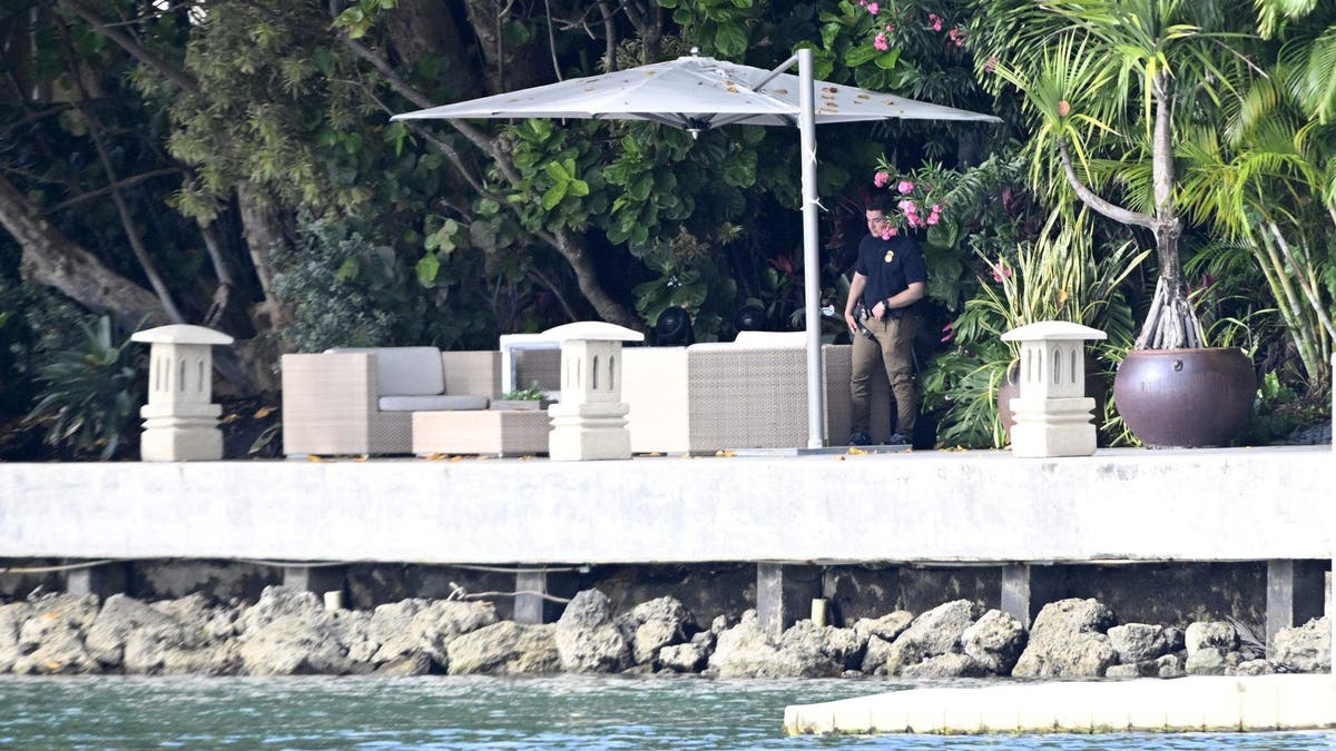 Investigator walks along Diddy's waterfront patio