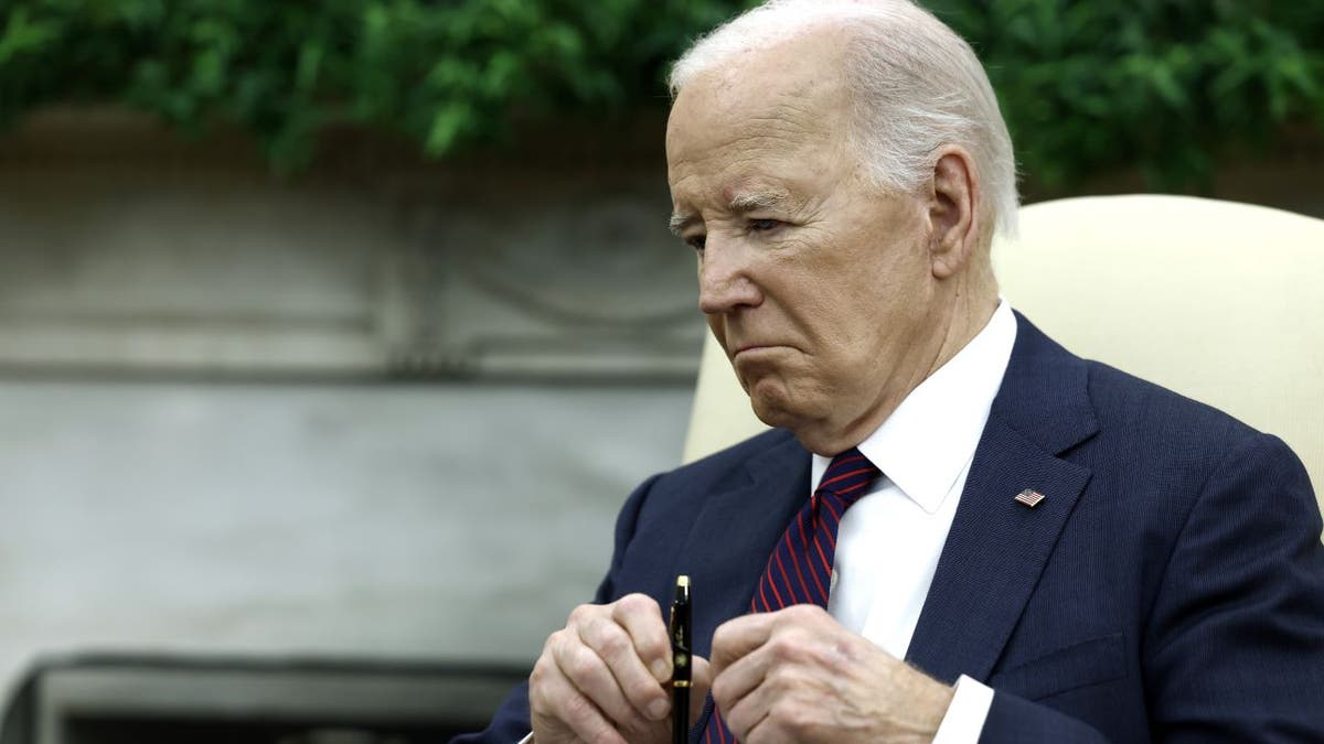 Close-up of Biden listening