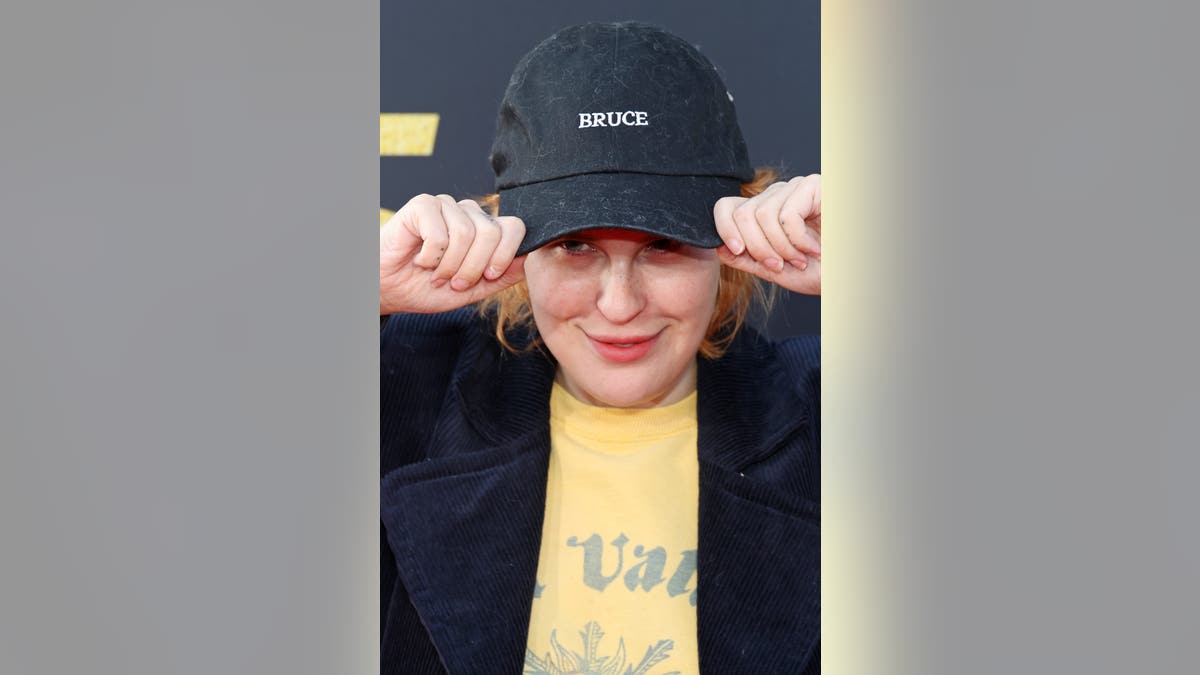 Tallulah Willis wearing a black hat with the name "Bruce" embroidered.