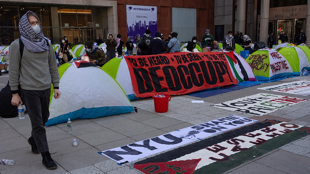 NYU shelter encampment pinch anti-Israel signs