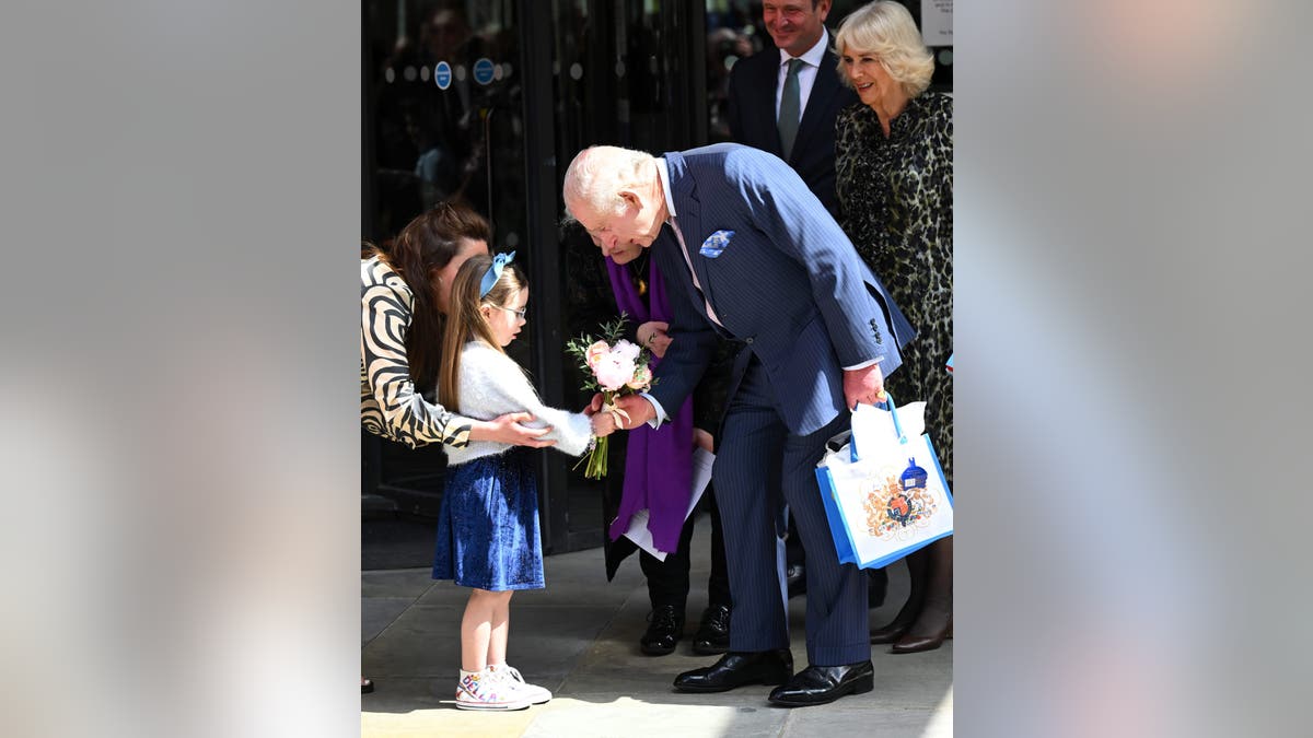 King Charles greets child