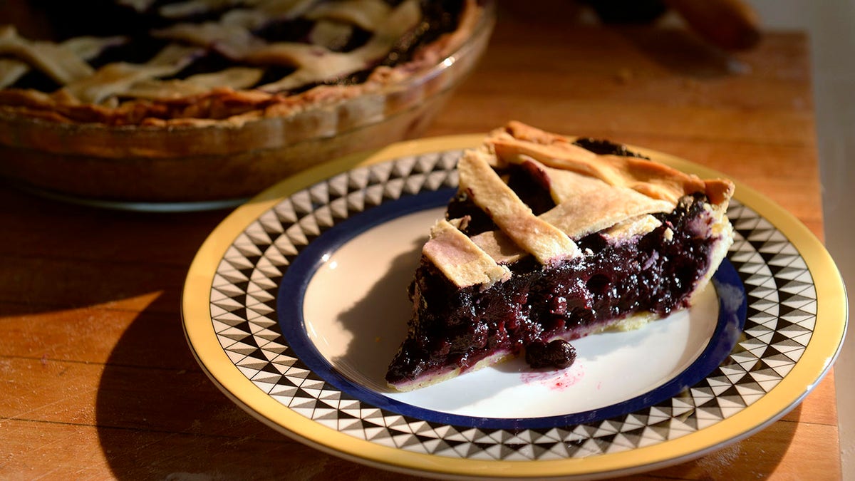 slice of latticed blueberry pie