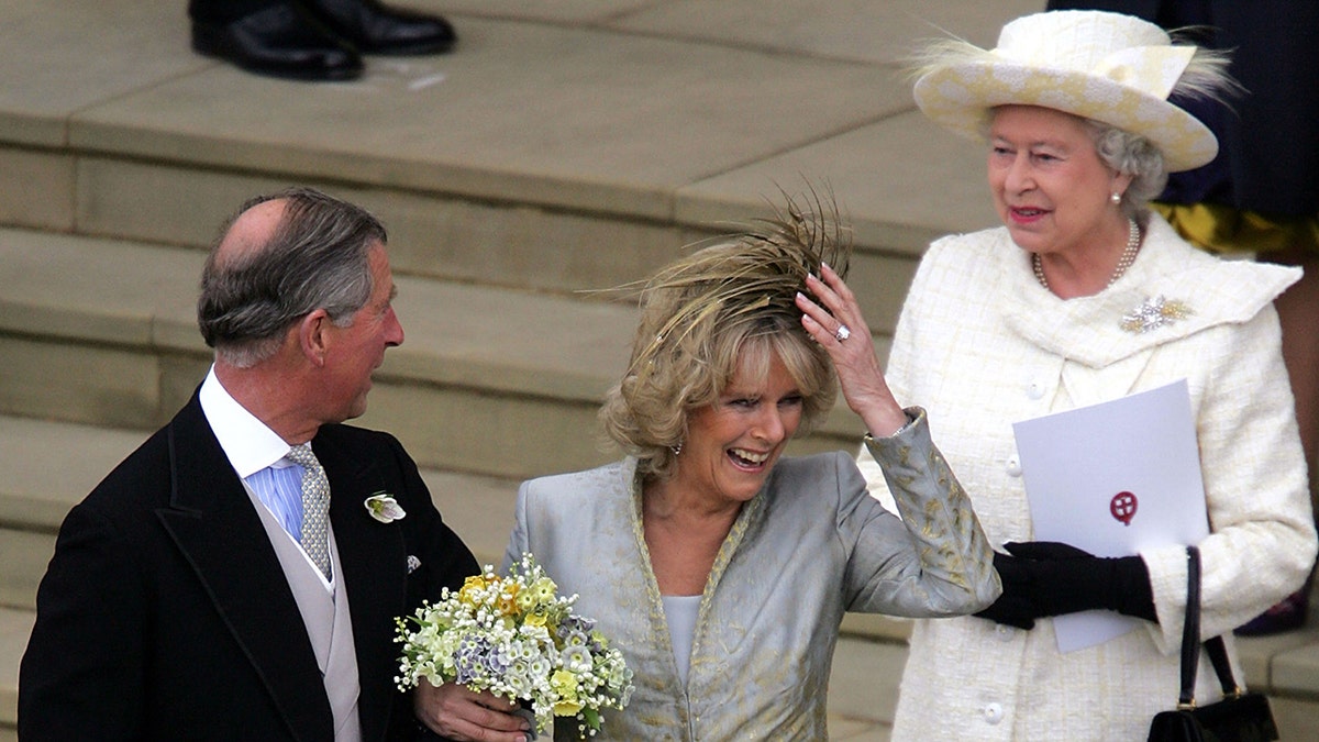 Camilla smiling connected her wedding time successful betwixt Prince Charles and Queen Elizabeth II