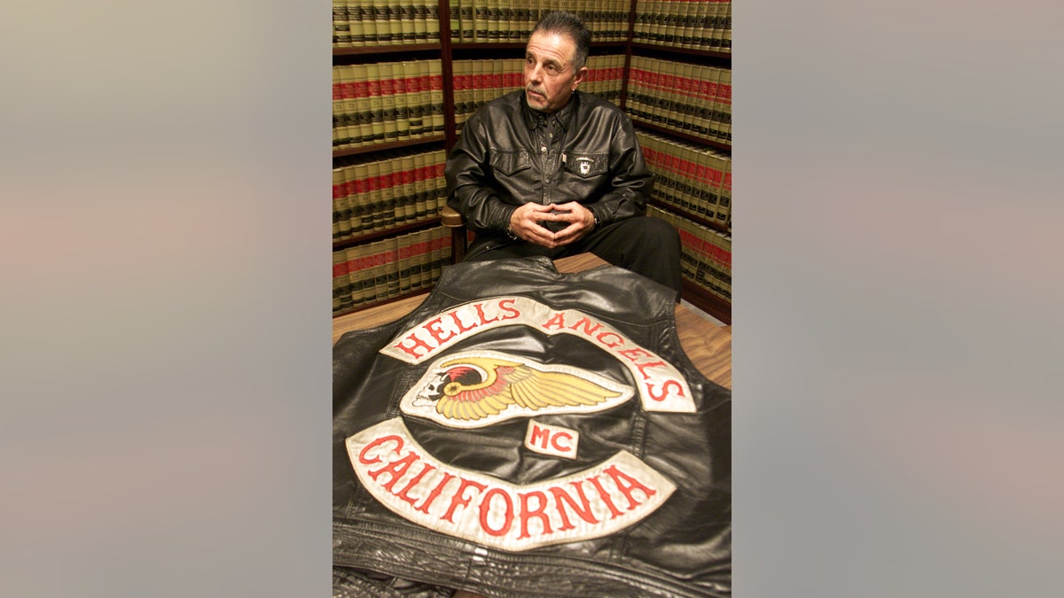 George Christie sitting in front of a Hells Angels patch