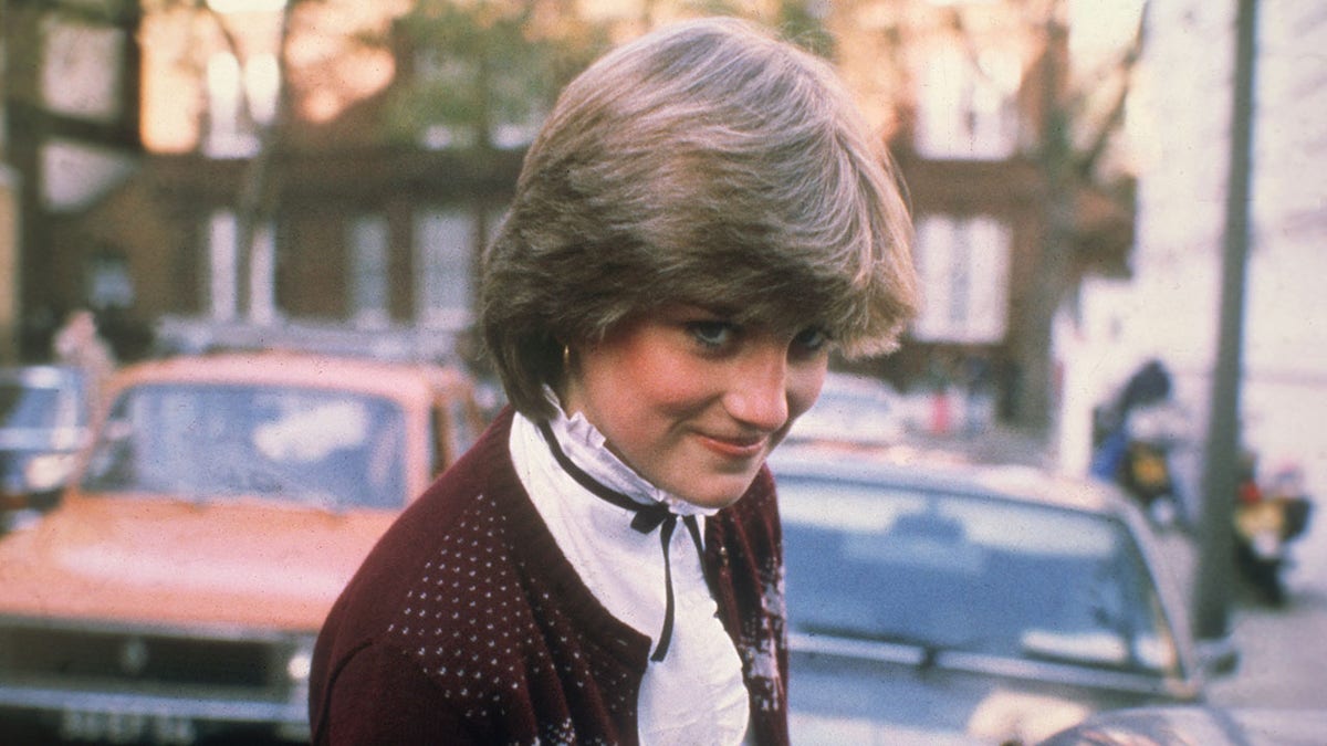 A shy Lady Diana Spencer looking up.