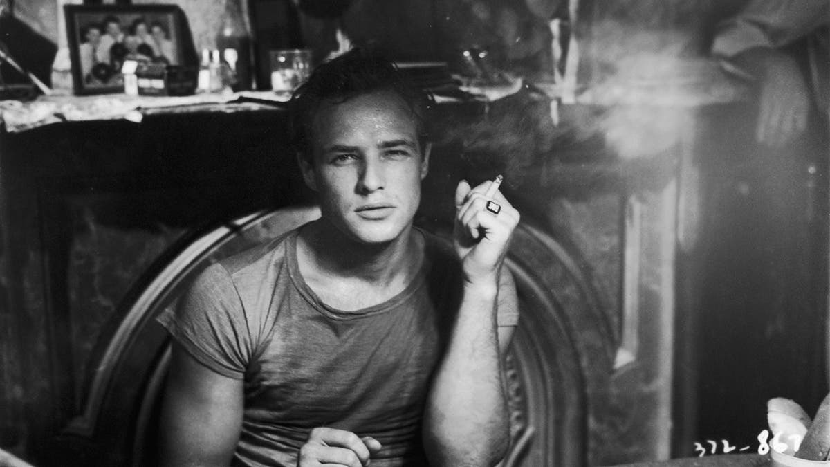 A close-up of Marlon Brando smoking a cigarette