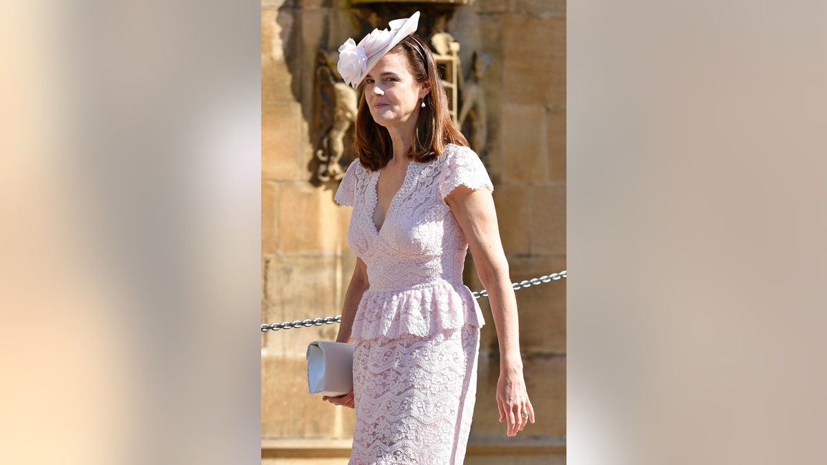 Samantha Cohen wearing a powder pinkish lace dress and a matching fascinator
