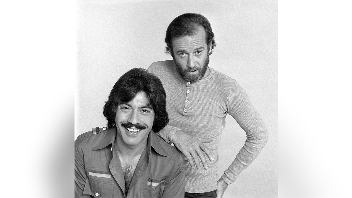 George Carlin standing next to Tony Orlando with his hand on Orlandos shoulder
