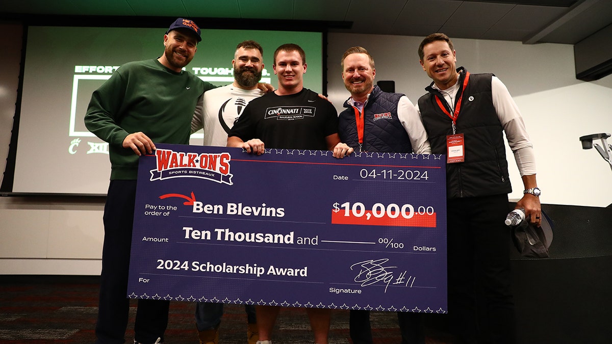 Kelce brothers pinch cheque and Blevins