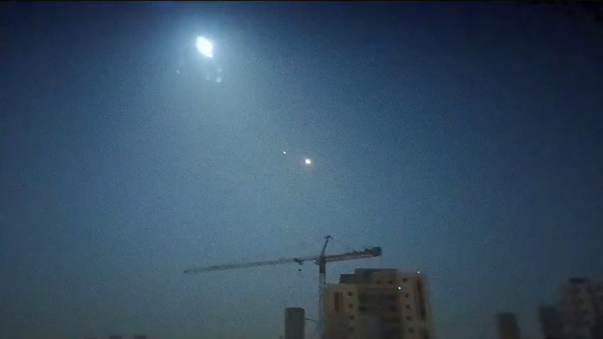 Israeli defense systems intercept an Iranian missile over Maale Adumim, near Jerusalem, in the early hours of April 14, 2024.