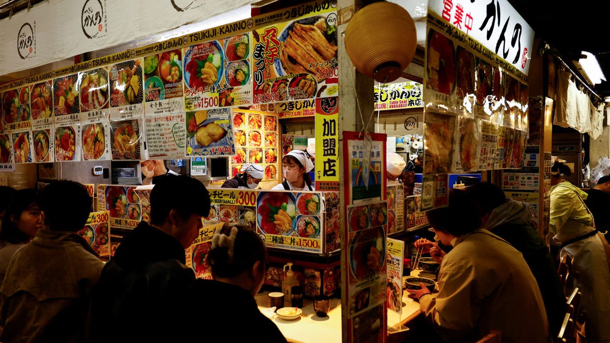 People have lunch at a seafood restaurant in Japan