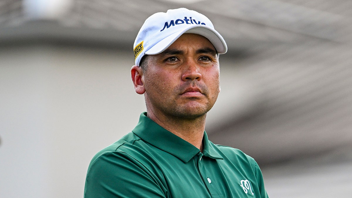 Jason Day looks out on golf course