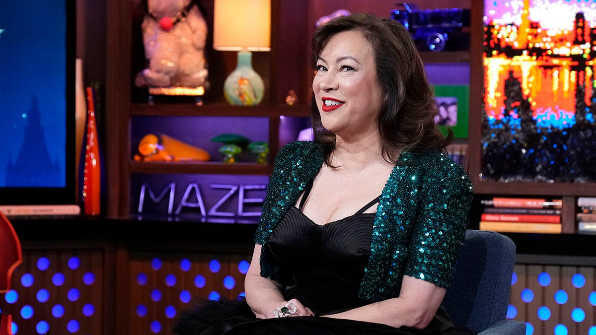 Jennifer Tilly sitting and smiling connected nan group of Watch What Happens Live
