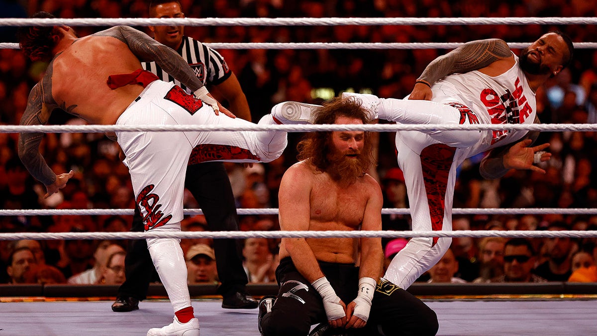 The Usos super kick Sami Zayn