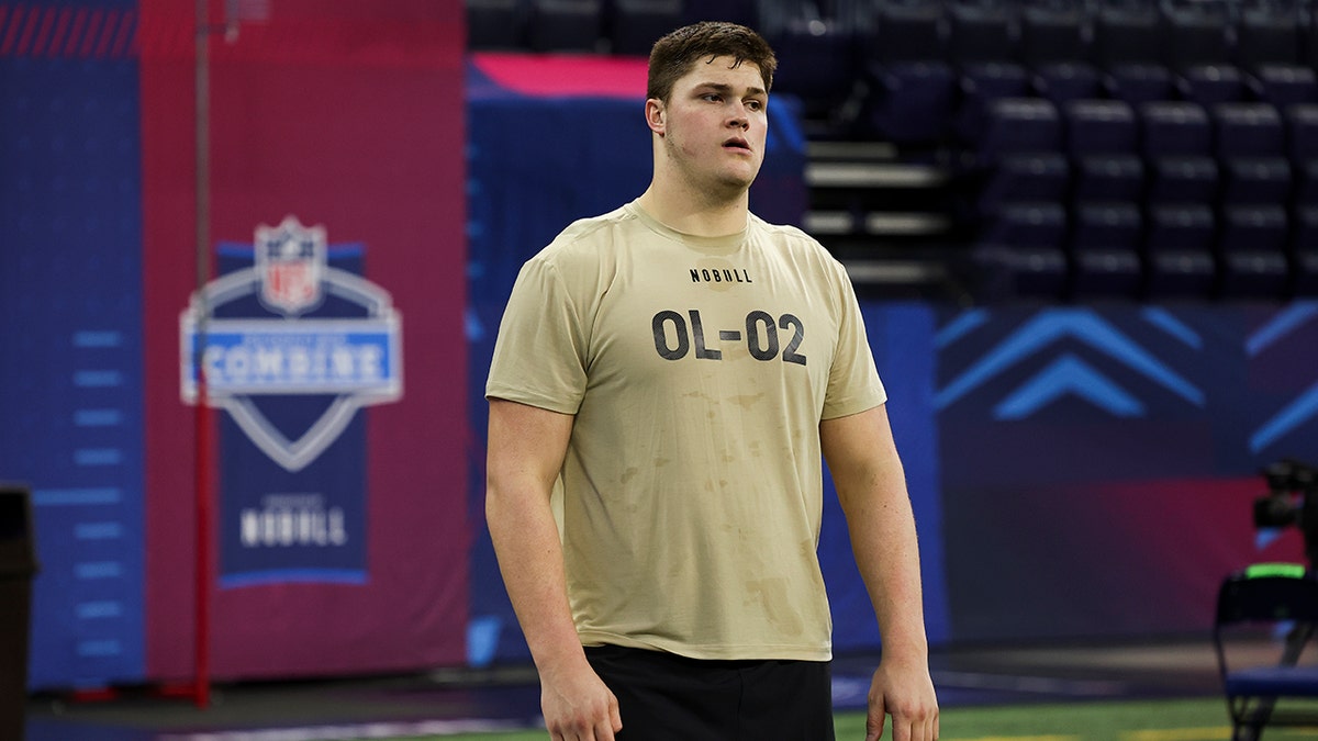 Joe Alt looks on at NFL Combine