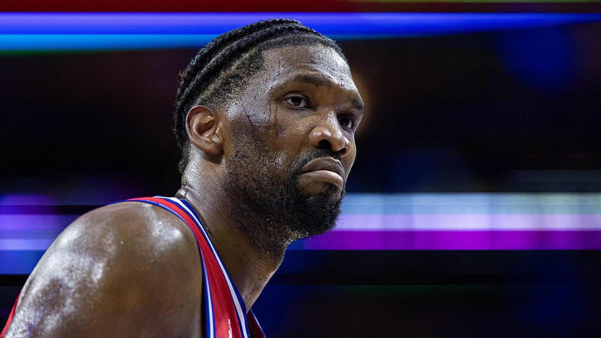 Joel Embiid looks on