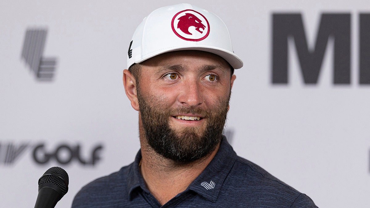 Jon Rahm talks to reporters