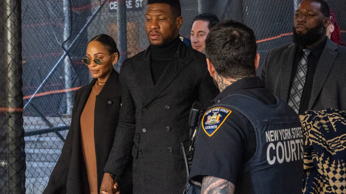 Jonathan Majors leaving court with girlfriend Meagan Good