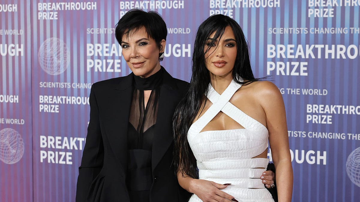 Kris Jenner and Kim Kardashian posing on the red carpet together