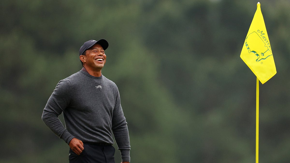 Tiger Woods laughs