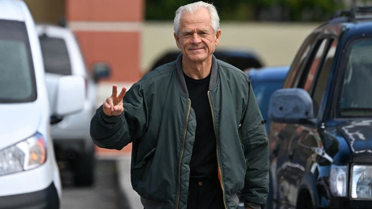 Peter Navarro giving the peace sign