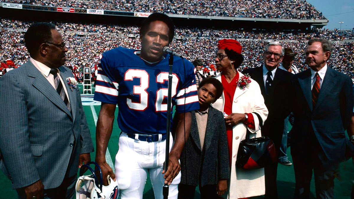 O.J. Simpson is photographed at a football game