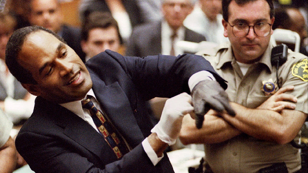 O.J. Simpson wearing the blood stained gloves found by Los Angeles Police