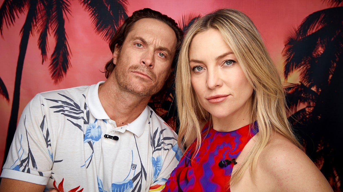 Oliver Hudson and Kate Hudson pose for a photo