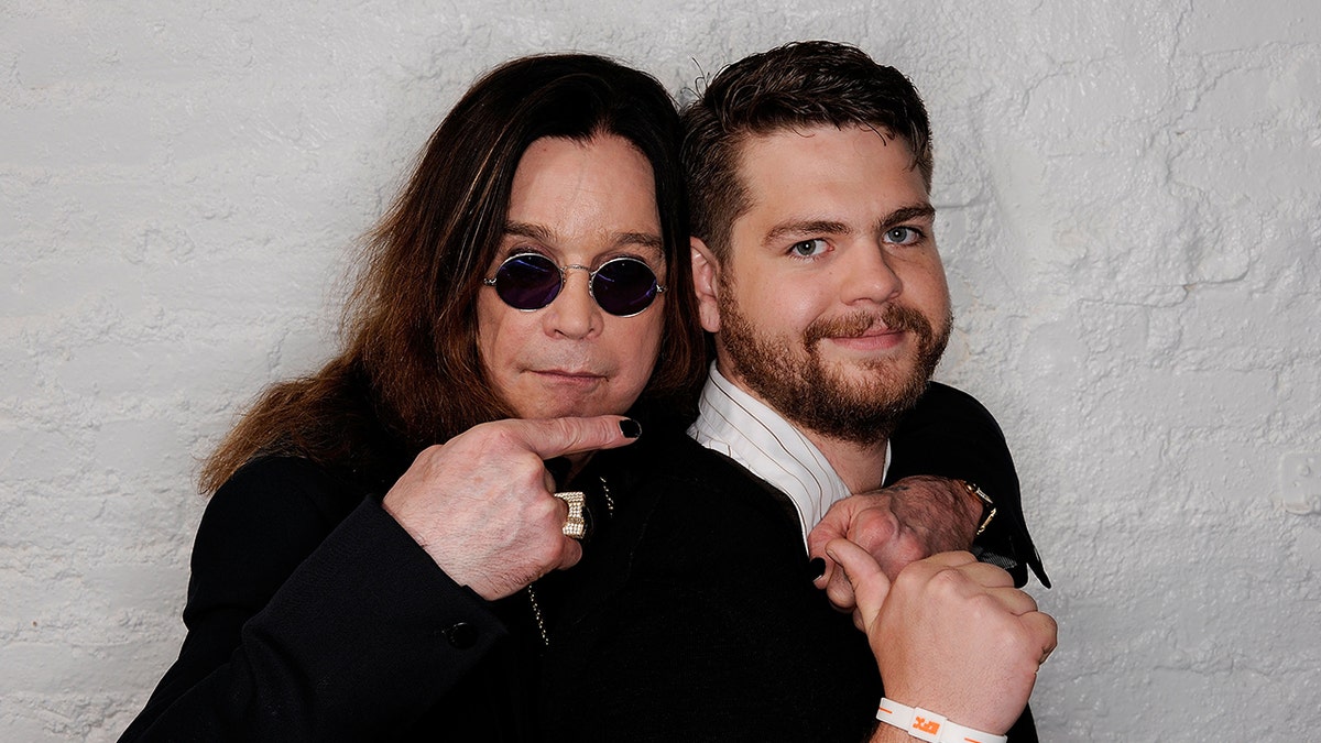 Ozzy Osbourne and Jack Osbourne airs for a photo