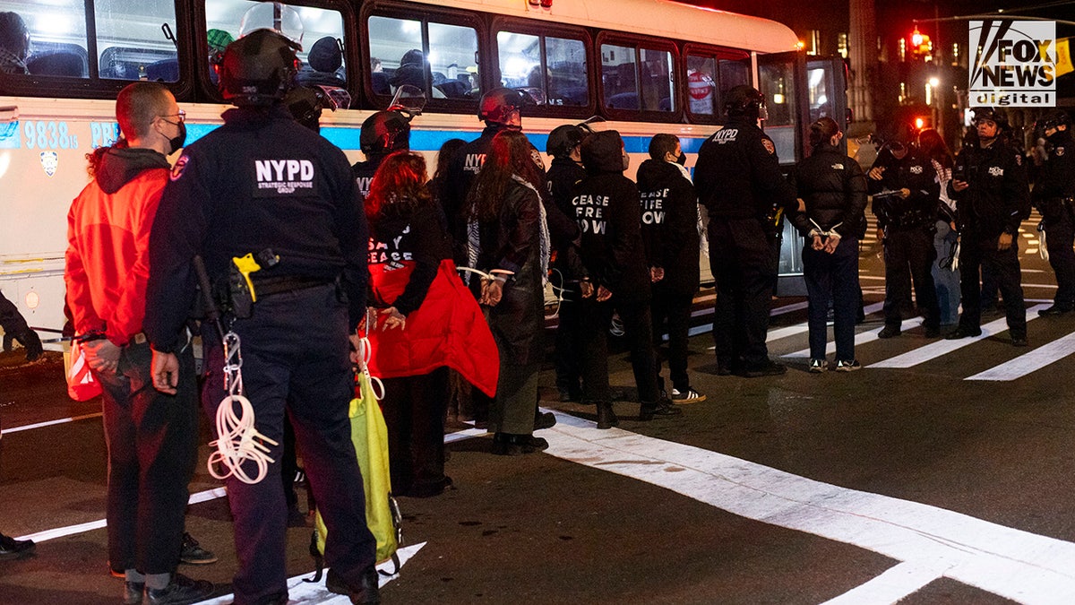 Pro-Palestinian Jewish demonstrators are arrested and placed on NYPD buses during a Seder protest one block from Senator Chuck Schumer’s Brooklyn home