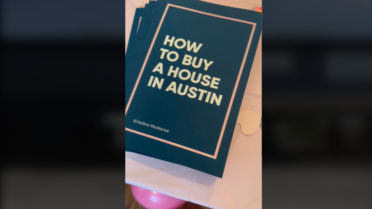 Dark green booklets titled 'How to Buy a House in Austin' on a table