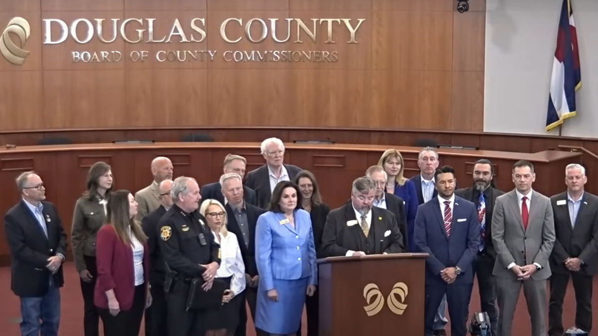 Douglas County officials standing at press conference