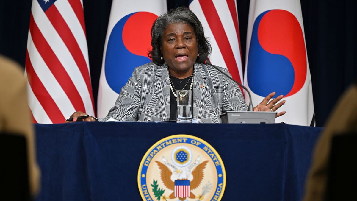 U.S. Ambassador to nan United Nations Linda Thomas-Greenfield speaks during a property convention astatine nan American Diplomacy House successful Seoul successful beforehand of American and South Korean flags.