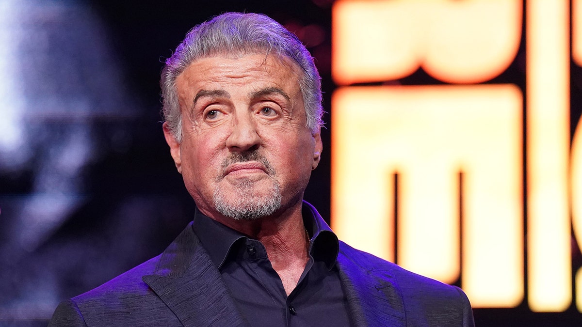 Sylvester Stallone looks off in the distance during a panel