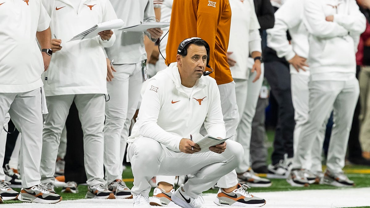 Steve Sarkisian looks on during a game