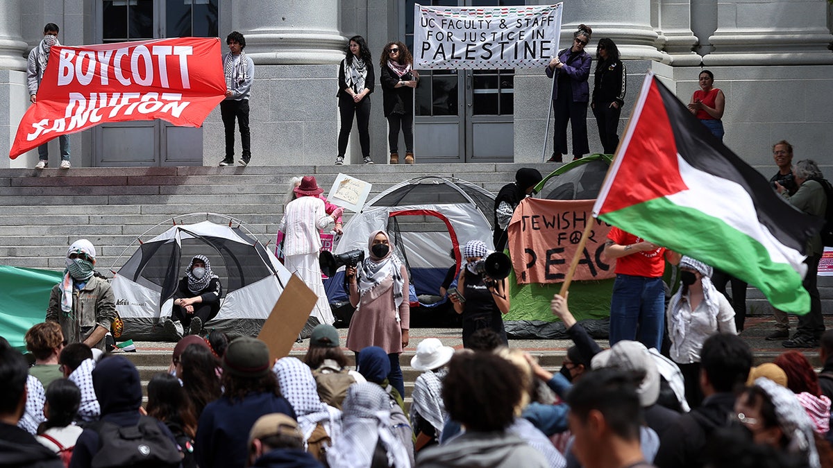 Pro-Palestinian protesters set up a tent encampment during a demonstration in front of Sproul Hall on the UC Berkeley campus