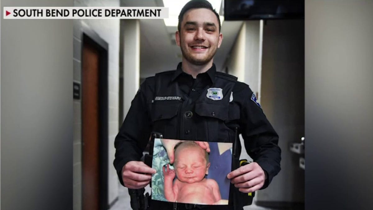 Matthew Hegdus-Stewart with picture of himself as a baby