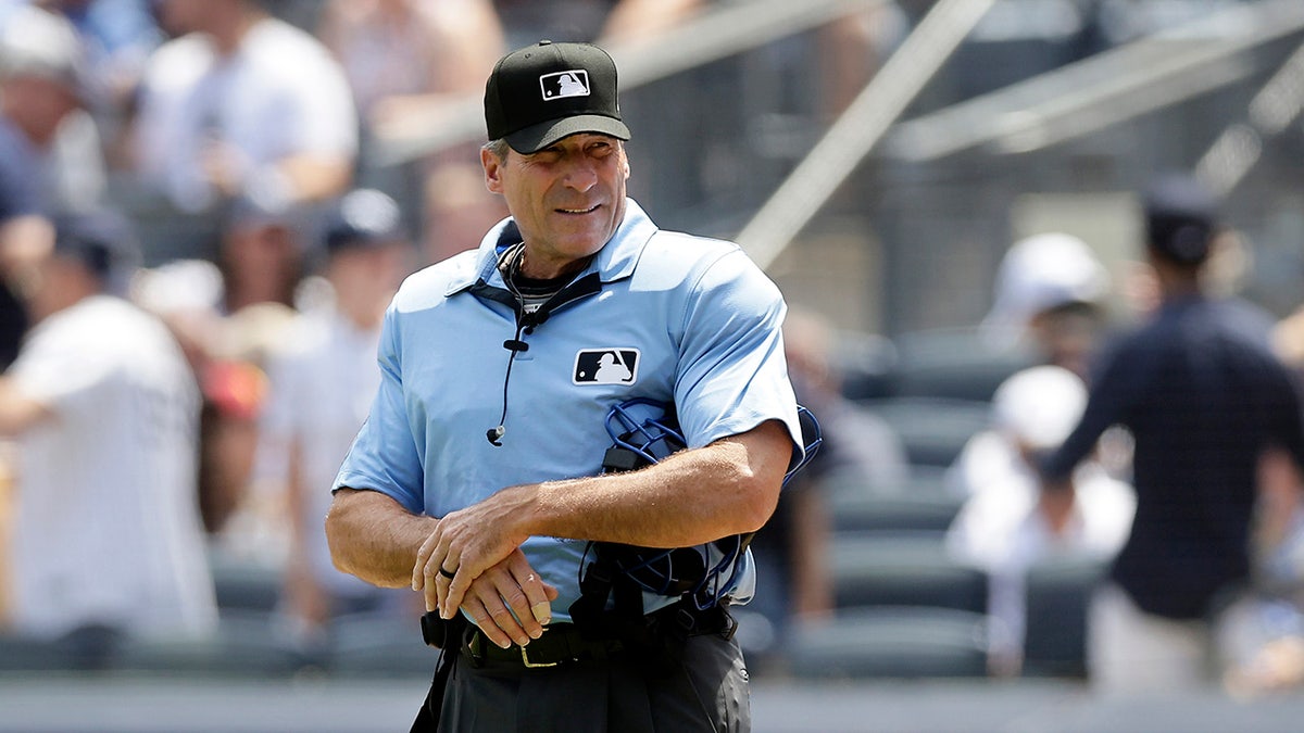 Angel Hernandez behind plate