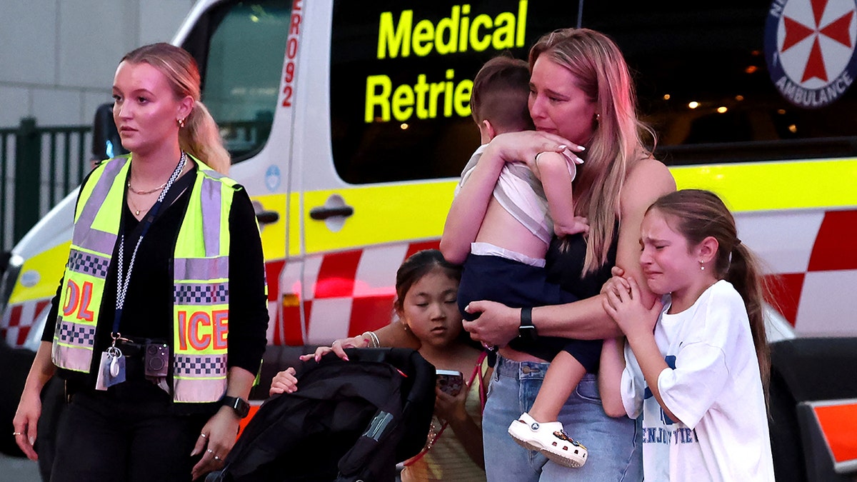 Families walk out of Australian mall after man went on a stabbing spree